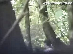Couple caught in the woods